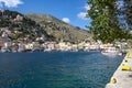 View of the Colorful Houses, Boats and Shops at the Harbor of Symi Greece Royalty Free Stock Photo