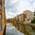 View of colorful houses and their reflection in a canal in Girona, Spain. Royalty Free Stock Photo