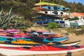View of colorful kayaking equipment on a sandy beach, process of kayaking by the Ionian sea beach, with canoe kayak boat paddling Royalty Free Stock Photo