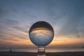 view of colorful nature at sunset inside crystal ball.