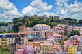 View of colorful residential buildings and the ancient castle of Castelo de S.Jorge in Lisbon