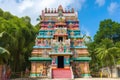 view of colorful and vibrant hindu temple, surrounded by greenery