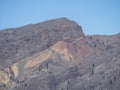 View on colorful vocanic rock of crater Caldera de Taburiente with mountain peak Roque de los Muchachos on the island La Royalty Free Stock Photo