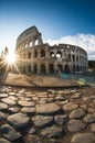 View of the Colosseum in Rome and morning sun, and roman stones, Italy, Europe Royalty Free Stock Photo