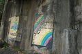 View of colourful graffiti on concrete wall.