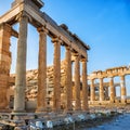 View of columns of Erechtheion and Parthenon on Acropolis, Athens, Greece against blue sky Royalty Free Stock Photo