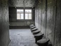 View of a common toilet inside of one of the barracks where prisoners lived at the Sachsenhausen Concentration camp Royalty Free Stock Photo