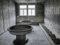 View of a common toilet inside of one of the barracks where prisoners lived at the Sachsenhausen Concentration camp Royalty Free Stock Photo