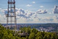 View of communication towers with blue sky, mountain and cityscape background. Top view of the radio tower in the city Royalty Free Stock Photo