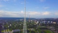 View of communication towers with blue sky, mountain and cityscape background. Video. Top view of the radio tower in the Royalty Free Stock Photo