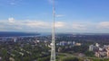 View of communication towers with blue sky, mountain and cityscape background. Video. Top view of the radio tower in the Royalty Free Stock Photo