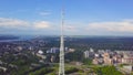 View of communication towers with blue sky, mountain and cityscape background. Video. Top view of the radio tower in the Royalty Free Stock Photo