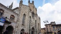 View of Como Cathedral, cattedrale di Santa Maria Assunta, Gothic cathedral with rococo cupola with tourists, Como, Italy