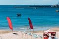 View from Conceicao Beach in Cascais, Portugal of a group of unidentifiable people on a gigant standup paddle board