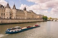 View of Conciergerie - former prison and part of old royal palace on Seine river bank in Paris, France