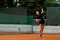 view on confident woman tennis player with racket ready to hit a tennis ball. Royalty Free Stock Photo