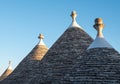 View of conical roofs of traditional trulli houses in Alberobello in the Itria Valley, Puglia Italy