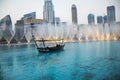 View of a construction in downtown Dubai, Dubai opera and Dubai fountain during sunset