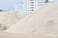 View of the construction of a large house with a mountain of rub