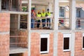 View of construction in progress with group of architects