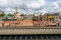 A view of a construction site in between the railway tracks and city