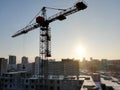 View of a construction site on a winter sunny frosty day. The construction of residential buildings using tower cranes Royalty Free Stock Photo