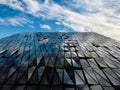 Skyscraper reflecting clouds in the sky Royalty Free Stock Photo