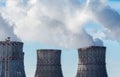 View of cooling towers of nuclear power plant with white smoke or vapour Royalty Free Stock Photo