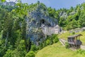 A view of the countryside and medieval castle built into the cliff face at Predjama, Slovenia Royalty Free Stock Photo