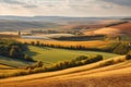 a view of the countryside, with rolling hills and golden fields Royalty Free Stock Photo