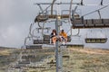 View of a couple and daughter enjoying the view on cable car railway circuit, top at the mountains of the Serra da Estrela natural Royalty Free Stock Photo