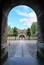 View of the courtyard and a walkway with two gates leading to t