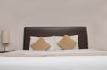 View of cozy and luxury king size bed in hotel. Asian contemporary decoration style