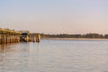 View of the Crab Dock in Winchester Bay, Oregon, with small waves breaking along the sandy beach. Royalty Free Stock Photo