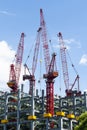 View of cranes above steel structure for building construction. Royalty Free Stock Photo