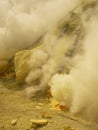 View on the crater of the Ijen volcano in Indonesia, a sulfur mine and toxic gaz Royalty Free Stock Photo