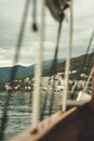 View of Croatian houses in the mountains through the sailing ropes of ships. cloudy day Royalty Free Stock Photo