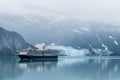 A view of a cruise ship sailing past the Margerie Glacier in Glacier Bay, Alaska Royalty Free Stock Photo