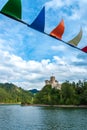 View from the cruise ship to the castle in Niedzica. A colorful garland in the foreground. Focus in the background. Czorsztyn,