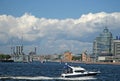 View of Cruiser Aurora on eternal parking and a motor boat on the river Neva in summer time, ST. PETERSBURG, RUSSIA