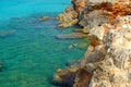 View on the crystal sea water and unknown person swiming on Menorca Royalty Free Stock Photo