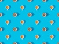 View of cups of fresh coffee on blue, seamless background pattern Royalty Free Stock Photo