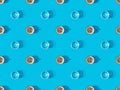 View of cups of fresh coffee and glasses of water on blue, seamless background pattern