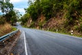 View of curvy asphalt country road along the mountains and forest. Royalty Free Stock Photo