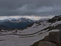 View of curvy mountain pass Grossglockner High Alpine Road in the Alps, Austria in early summer with snow-capped mountains. Royalty Free Stock Photo