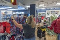 View of customers in Macy`s clothing department for children. New York. Royalty Free Stock Photo