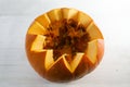 View into a cut open pumpkin with fruit and seeds