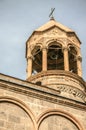 View of cylindrical bell tower with a forged cross in of the Church of St.Mesrop Mashtots