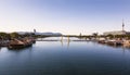 View of the Danube and the pontoon bridge connecting the Leopoldstadt and Donaustadt districts of Vienna at sunset.