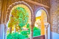 The view on Daraxa`s Garden through the windows of Lions Palace, Alhambra, Granada, Spain Royalty Free Stock Photo